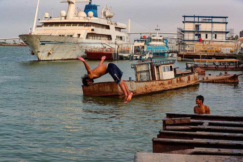 People swim in the Shatt al-Arab waterway to beat the heat, during Eid al-Fitr holiday in Basra, Iraq. AP Photo
