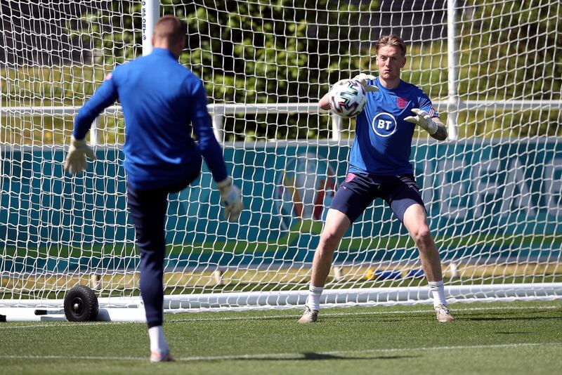 England goalkeeper Jordan Pickford, right, during training. PA