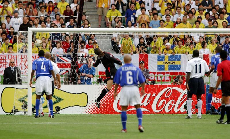 Football - 2002 FIFA World Cup Korea/Japan(tm) , Quarter Final , England v Brazil , Shizuoka Ecopa Stadium , Fukuroi City , Japan , 21/6/02  
England's David Seaman can only watch as he is lobbed by Ronaldinho from a free kick to score the winning goal for Brazil 
Mandatory Credit:Reuters / Action Images / Darren Walsh 
Digital