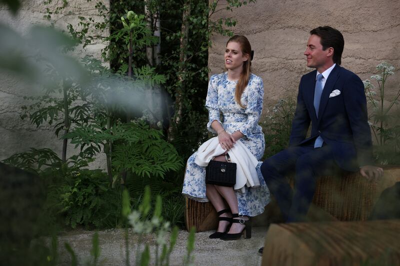 Princess Beatrice, elder daughter of Prince Andrew, Duke of York, and Edoardo Mapelli Mozzi, her husband, admire one of the gardens at the Chelsea Flower Show. Getty