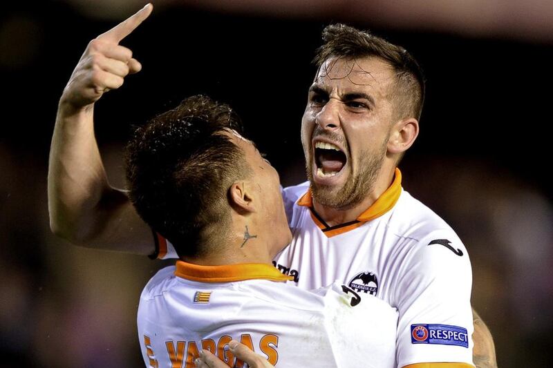 Paco Alcacer celebrates a goal for Valencia against FC Basel in a 2014 Europa League match. Jose Jordan / AFP