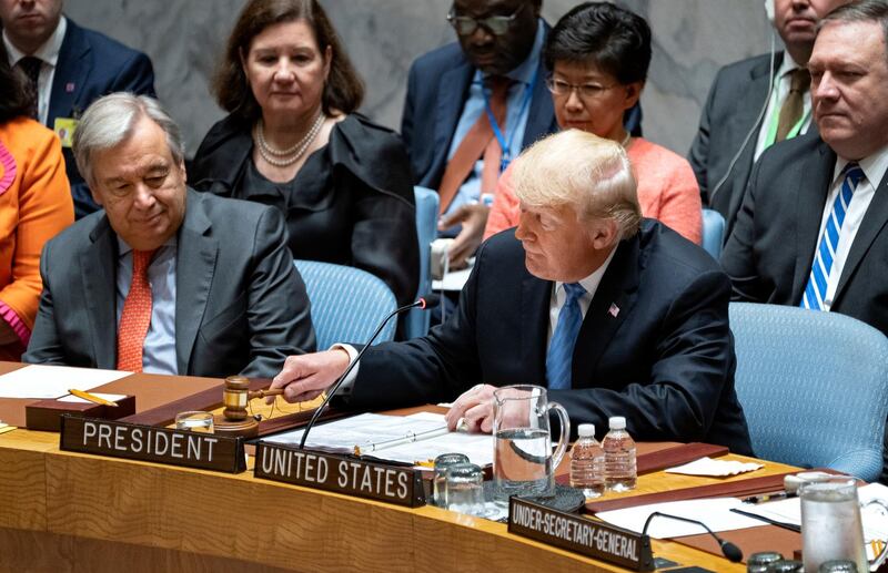 President Donald Trump pounds a gavel before addressing the United Nations Security Council. AP
