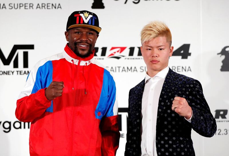 Undefeated boxer Floyd Mayweather Jr. of the U.S. poses for a photograph with his opponent Tenshin Nasukawa during a news conference to announce he is joining Japanese Mixed Martial Arts promotional company Rizin Fighting Federation, in Tokyo, Japan November 5, 2018.   REUTERS/Issei Kato TPX IMAGES OF THE DAY