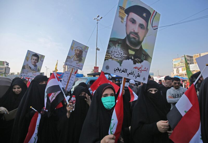 Some of the newcomers carried portraits of Hashed fighters killed while battling extremists, and of the country's influential Shiite cleric, Grand Ayatollah Ali Al Sistani. AFP