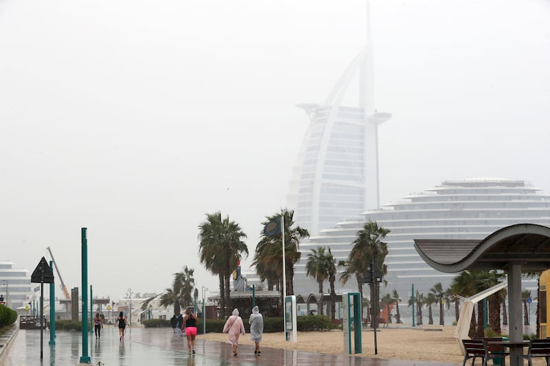 The rain comes down at the beach in Dubai. Chris Whiteoak / The National