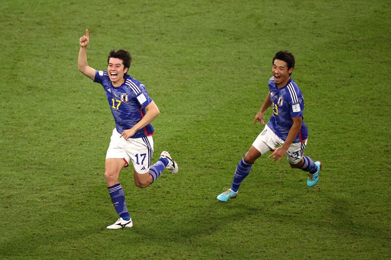 Ao Tanaka celebrates after scoring. Getty