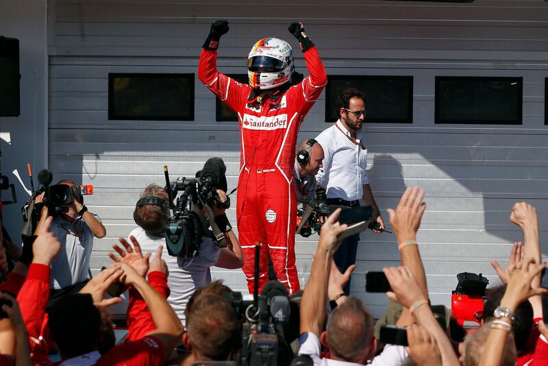 Ferrari driver Sebastian Vettel of Germany celebrates after winning the Hungarian Formula One Grand Prix, at the Hungaroring racetrack in Mogyorod, northeast of Budapest, Sunday, July 30, 2017. (AP Photo/Darko Bandic)