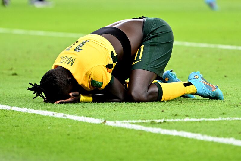 Awer Mabil of Australia reacts after defeating Peru in the 2022 World Cup playoff match. Getty Images