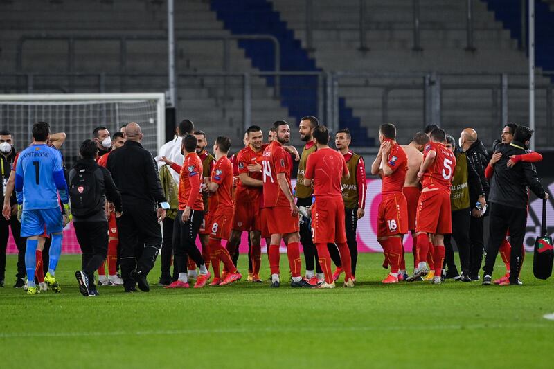 North Macedonia players celebrate after the match. EPA