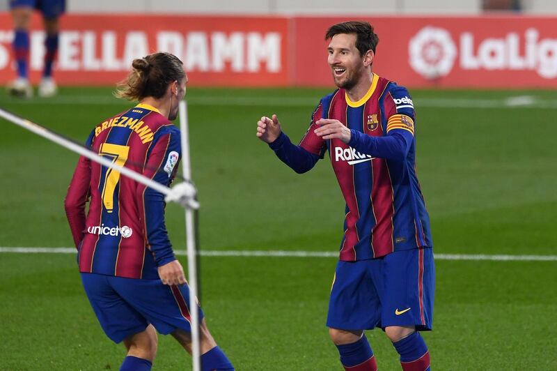 Barcelona's French midfielder Antoine Griezmann celebrates his goal with Barcelona's Argentine forward Lionel Messi during the Spanish League football match between Barcelona and Real Betis at the Camp Nou stadium in Barcelona on November 7, 2020. / AFP / Josep LAGO
