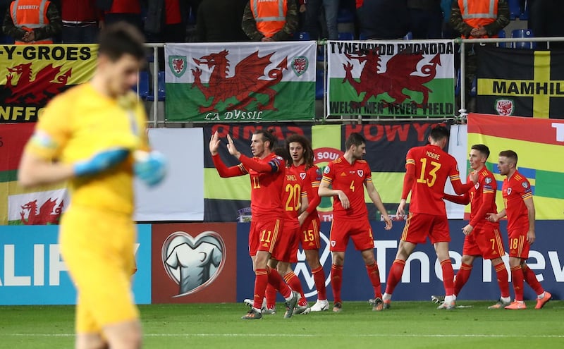 Wales's Harry Wilson celebrates scoring their second goal with team mates. Reuters
