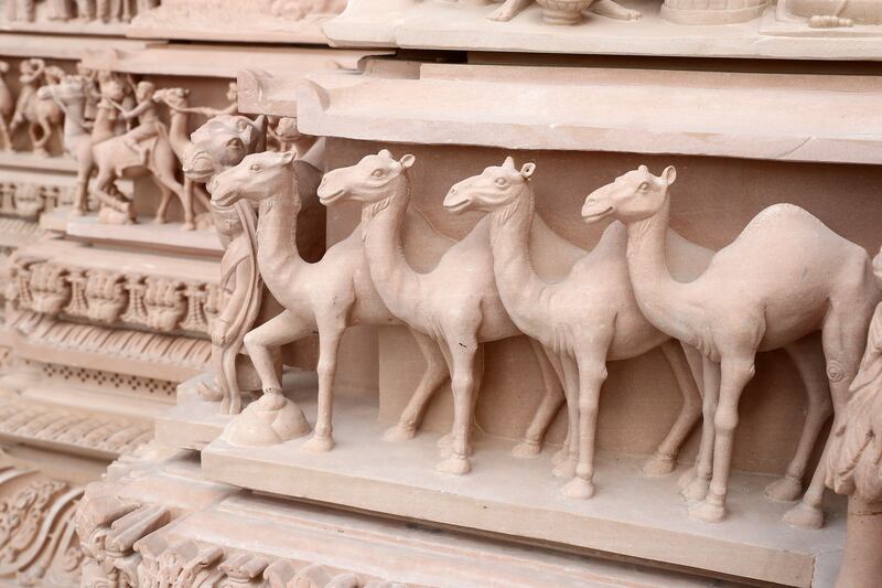 Decorative panels depict the camels of the Middle East, along with the elephant and peacock motifs usually seen in traditional Hindu temples. Pawan Singh / The National