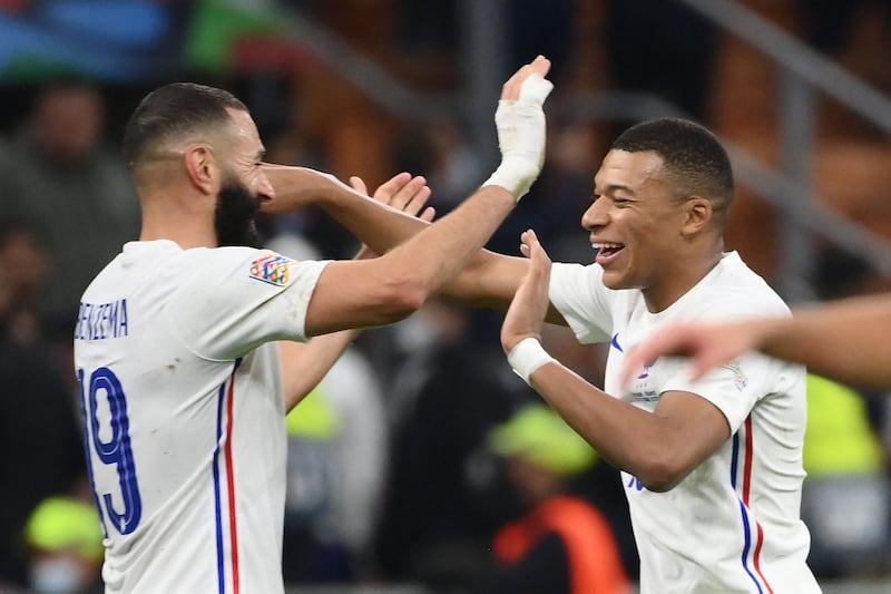 arim Benzema and Kylian Mbappe celebrate their victory at the end of the Nations League final. AFP