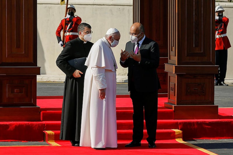 Iraq's President Barham Salih speaks with Pope Francis during a welcoming ceremony at the Presidental Palace in Baghdad. Reuters