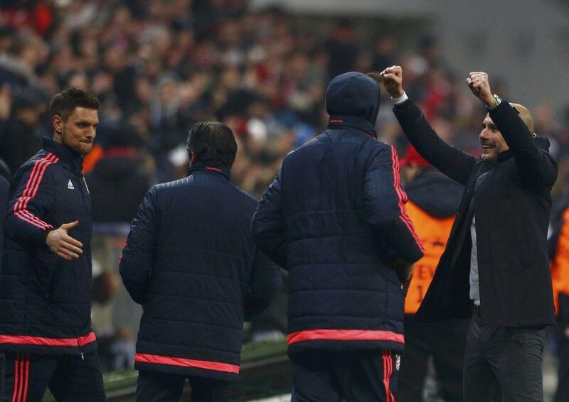 Bayern Munich’s coach Pep Guardiola celebrates with players after the match. REUTERS/Michaela Rehle