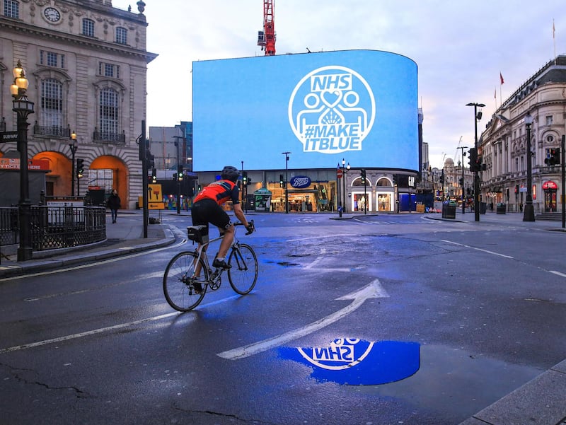 Light it BluePiccadilly Circus, Central LondonThursday 8 pm, lit up in blue for Thank you NHS. Cyclist on his one per day exercise. I am events and wedding photographer, based in central London, my job affected by pandemic totally. I always take my camera for my one per day walk. A captured moment of gratitude to our NHS. Photo by Alla Bogdanovic
