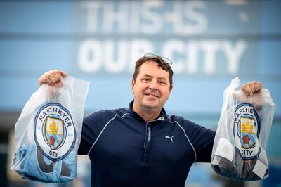 Feature on Manchester City FC at the Etihad complex and Manchester city centre.
PIC shows fan David Perks.