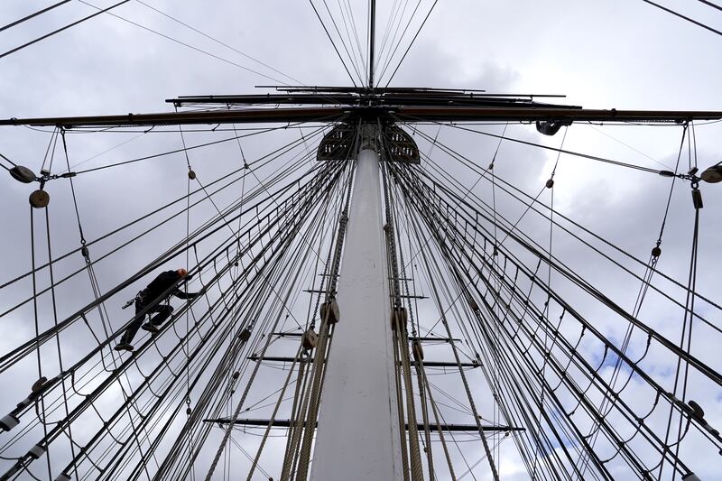 A climber scales the rigging of the Cutty Sark on Thursday in Greenwich, south London, at a preview of the Cutty Sark Rig Climb Experience, which opens to the public from Saturday. For the first time since the ship arrived in Greenwich in 1954, visitors will be able to climb the masts and enjoy views of the Thames and London. PA