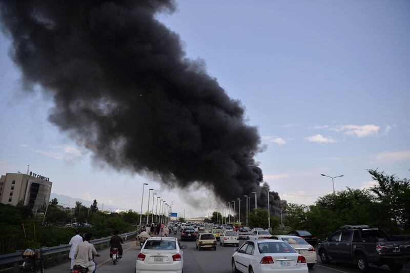 Black smoke billows across Islamabad.