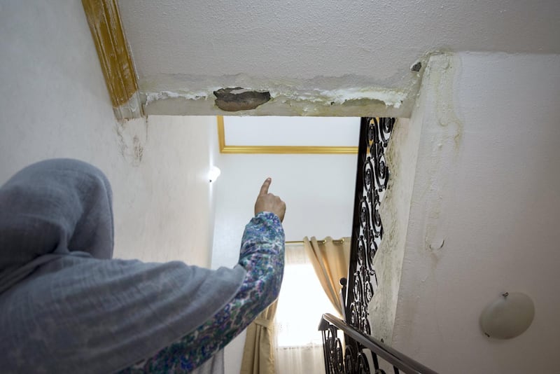 Fujairah, United Arab Emirates - Home owner showing water damage to her house at a residential area near Wadi in Al Raheeb Town in Dibba Al Fujairah. Ruel Pableo for The National for Ruba Haza's story