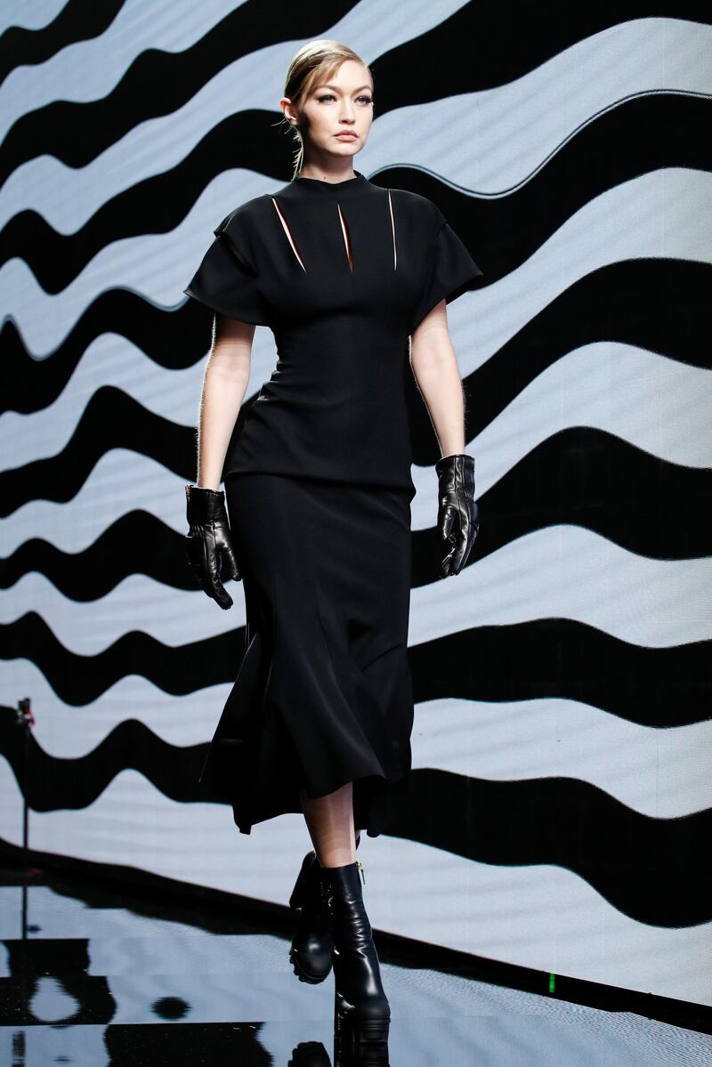 Gigi Hadid presents a creation by Versace during Milan Fashion Week, on February 21, 2020. EPA