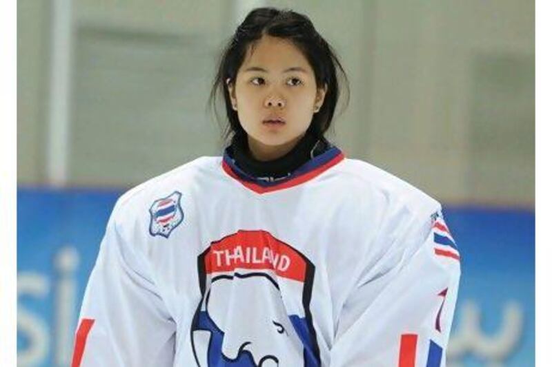 Wasunun Angkulpattanasuk, left, the Thailand goalkeeper, took up the position after watching her brother play.