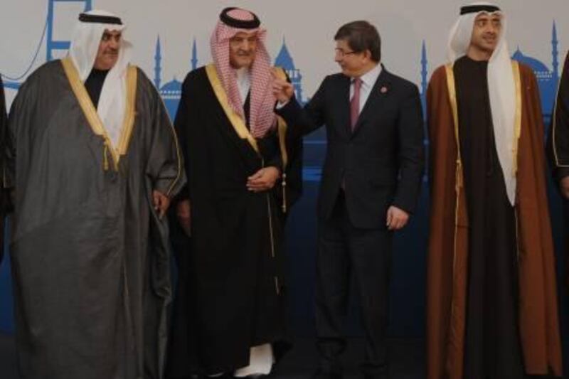 From left, Bahrain's Foreign Minister, Sheik Khalid bin AhmedI bin Mohammed al-Khalifa, Saudi Arabia's Foreign Minister Prince Saud al-Faisal, his Turkish counterpart Ahmet Davutoglu  and United Arab Emirates' Sheikh Abdullah bin Zayed al-Nahayan seenduring a group photo during  the Gulf Cooperation Council (GCC) Foreign ministers meeting in Istanbul, Turkey, Saturday,  Jan. 28, 2012 Turkey on Saturday expressed hope that the Arab League observers can help stop the violence in Syria which spiked over the past week. Foreign ministers of six Gulf countries, including Saudi Arabia, are meeting in Istanbul to explore new ways of cooperation with Turkey amid Iranian threats to immediately halt oil exports to Europe.(AP Photo) *** Local Caption ***  Turkey Gulf Meeting.JPEG-00be6.jpg