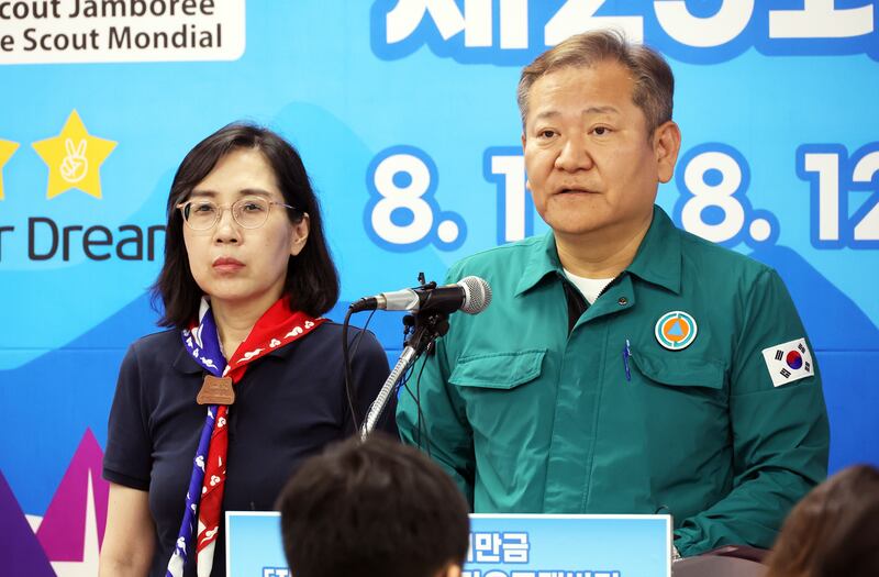 South Korean Interior Minister Lee Sang-min, right, gives a press briefing on the relocation of about 36,000 Scouts ahead of the arrival of Typhoon Khanun. EPA 