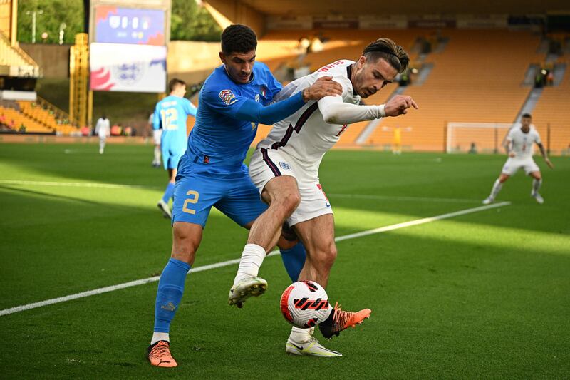 Italy's defender Giovanni Di Lorenzo fights for the ball with England midfielder Jack Grealish. AFP