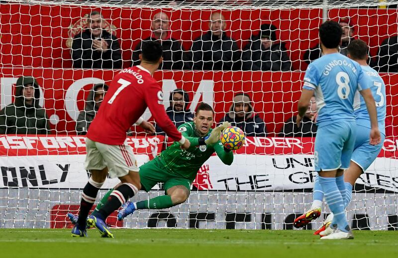 Manchester City goalkeeper Ederson saves Cristiano Ronaldo's volleyed shot. PA