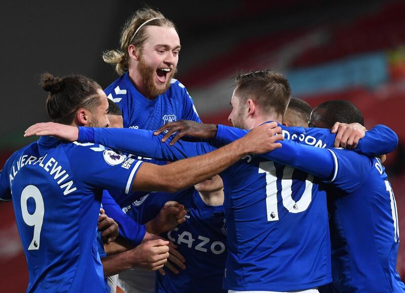 Everton's Gylfi Sigurdsson, (10), celebrates with teammates after scoring his side 2nd goal from the penalty spot during the English Premier League soccer match between Liverpool and Everton at Anfield in Liverpool, England, Saturday, Feb. 20, 2021. (Lawrence Griffiths/ Pool via AP)