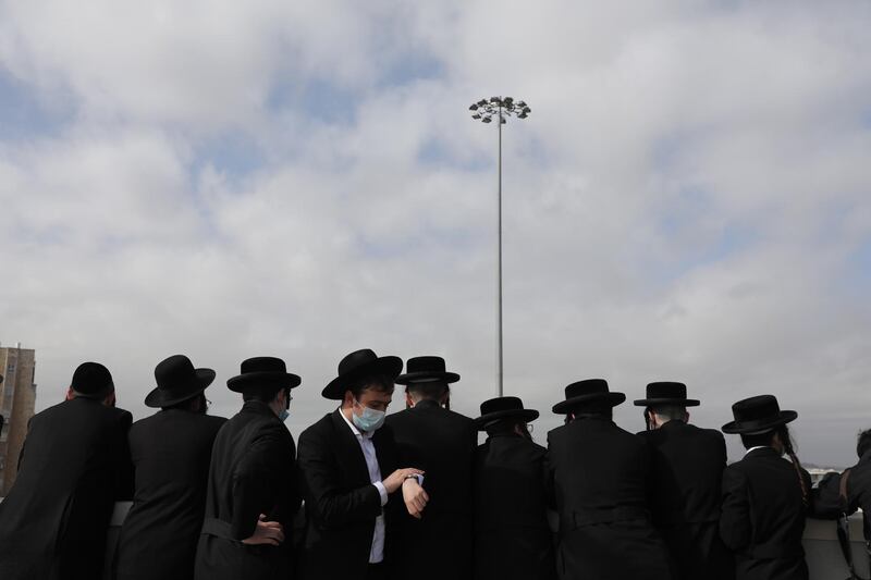 Ultra-Orthodox Jews gather around the body of Rabbi Meshulam Dovid Soloveitchik. EPA