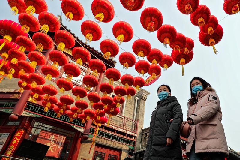 Red lanterns hang above an alley near the Houhai Lake in Beijing as China prepares to celebrate the Lunar New Year. Authorities discouraged people from travelling during the holiday to help curb the spread of coronavirus. AP