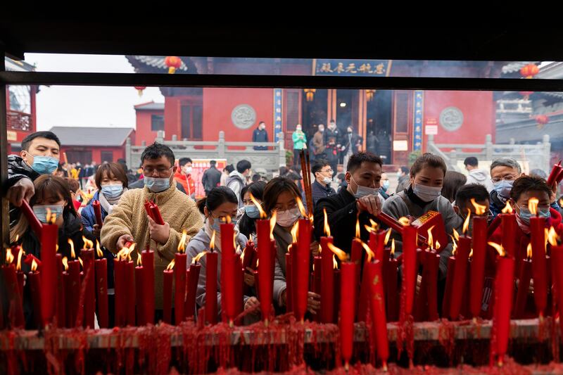 People pray at a temple in Shanghai, China. Today marks the fifth day of Spring Festival celebrations in China. Getty Images