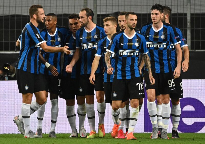 Diego Godin (4L) of Inter celebrates with teammates after scoring their second goal to make it 2-2. EPA