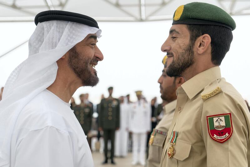 ABU DHABI, UNITED ARAB EMIRATES - April 23, 2018: HH Sheikh Mohamed bin Zayed Al Nahyan Crown Prince of Abu Dhabi Deputy Supreme Commander of the UAE Armed Forces (L), awards a member of the UAE Armed Forces with a Medal of Bravery for his service in Yemen, during a Sea Palace barza.

( Rashed Al Mansoori / Crown Prince Court - Abu Dhabi )