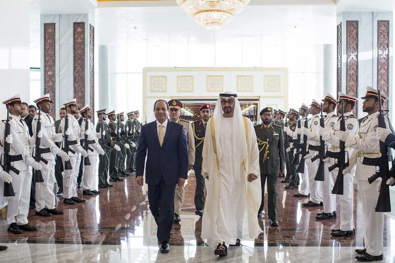 Sheikh Mohammed bin Zayed, Crown Prince of Abu Dhabi and Deputy Supreme Commander of the Armed Forces, greets Egyptian president Abdel Fattah El Sisi with an honour guard at the Presidential Airport on Tuesday. Ryan Carter / Crown Prince Court – Abu Dhabi