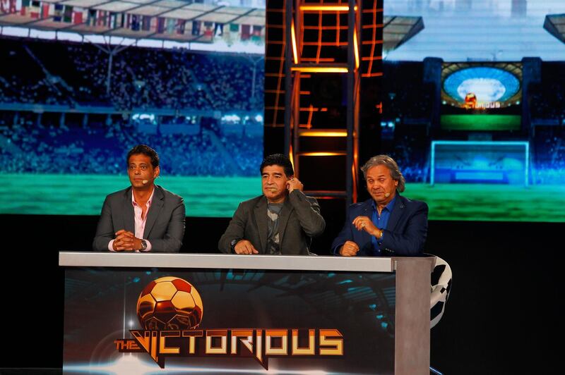 Dubai, United Arab Emirates - April 5, 2014.  ( Left to Right ) Hany Ramzy ( famous Egyptian ex footballer ), Diego Maradona ( world's famous footballer from Argentina ) and Rabah Madjer ( famous Algerian ex footballer ) at the gameshow Victorious.  ( Jeffrey E Biteng / The National )  Editor's Note;  John M reports.