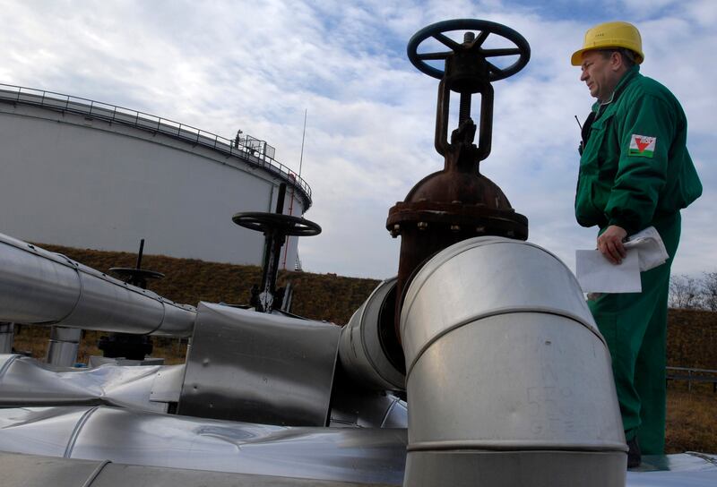 A Hungarian Oil and Gas Company engineer checks the receiving area of the Druzhba oil pipeline in Szazhalombata refinery, south of Budapest. AP