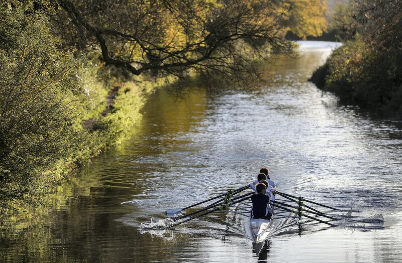 Rowers from the Winchester College Rowing club make their way along the Itchen Navigation in Winchester.