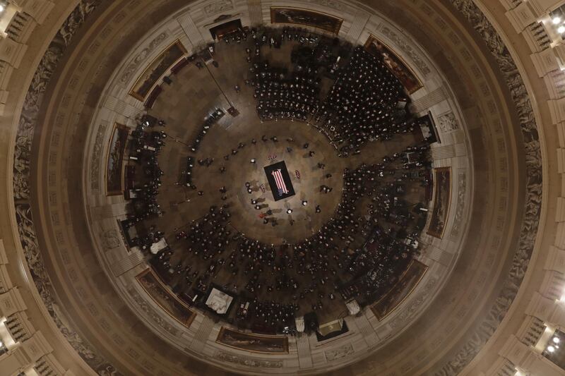 US members of the public pay their respects as former President George HW Bush lies in state at the Capitol Rotunda in Washington. Bloomberg