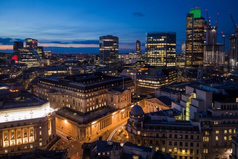 FILE: Automobiles create light trials as they pass the Bank of England (BOE) at dusk in City of London, U.K., on Monday, July 3, 2017. U.K. Prime Minister Theresa May will put her Brexit deal to Parliament for a decisive vote on Dec. 11, but after her plan was savaged from all sides, the signs are she���s on course to lose. The vote will mark the moment when British politicians decide whether to accept the contentious divorce terms May has struck with the European Union -- or put the country on course to crash out of the bloc with no agreement in place. Our editors look back at some of the key photographs that capture the Brexit journey. Photographer: Jasper Juinen/Bloomberg