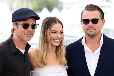 Brad Pitt, Margot Robbie and Leonardo DiCaprio debated the divisive question of whether Jack and Rose could have fitted on the same floating door in 'Titantic' at a recent press event. Getty Images