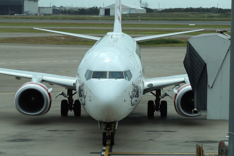 A Virgin plane arrives with passengers from the first flight from Melbourne since the Queensland border re-opened in Brisbane, Australia. Getty Images