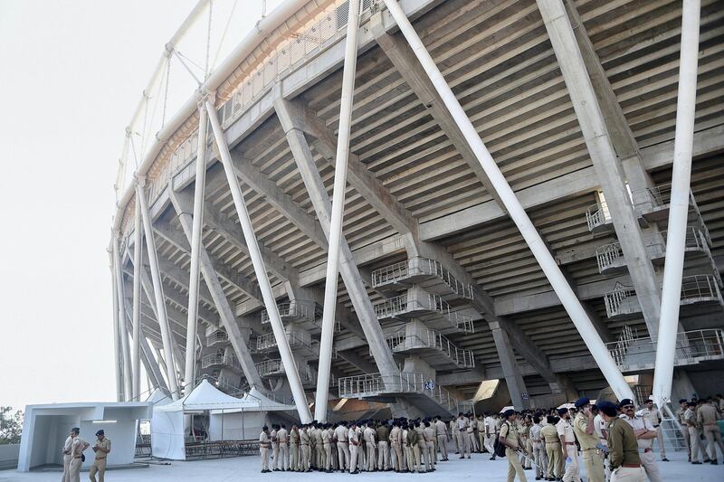 Police personnel gather in the campus of Sardar Patel Stadium, in Motera, on the outskirts of Ahmedabad, on February 21, 2020. - US President Donald Trump will open the world's biggest cricket stadium in India next week, but critics wonder whether it's just another vanity project by Prime Minister Narendra Modi in his home state. (Photo by SAM PANTHAKY / AFP)