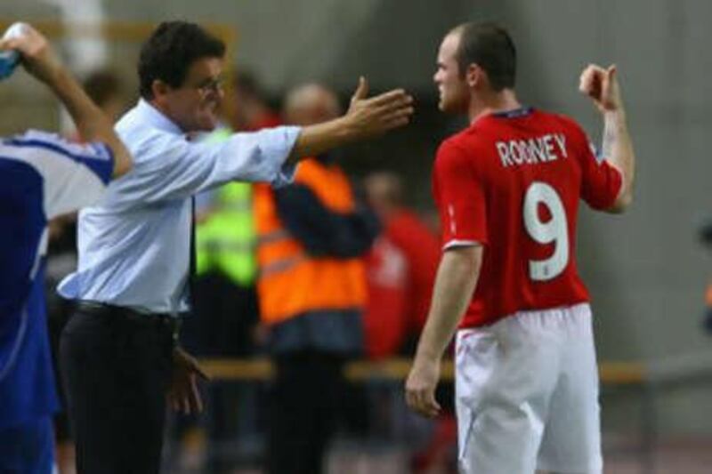 The England coach Fabio Capello said striker Wayne Rooney, right, had problems following his tactical instructions against Andorra.