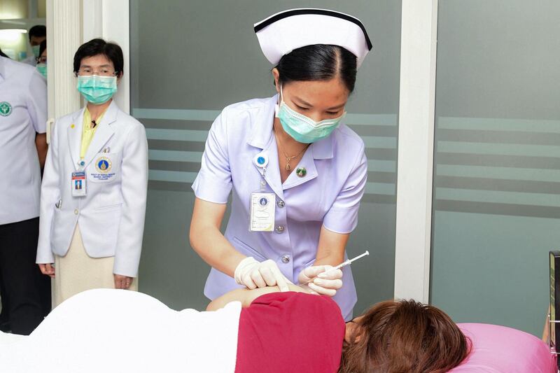 A nurse gives the NDV-HXP-S coronavirus vaccine to a trial volunteer at the Faculty of Tropical Medicine, Mahidol Univeristy, in Bangkok, Thailand.  AFP