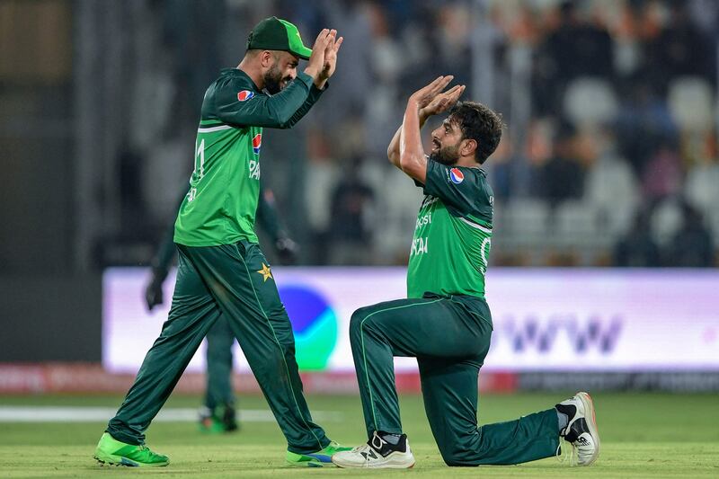 Pakistan's Haris Rauf, right, celebrates with teammates after taking the wicket of Nepal's Sompal Kami. AFP