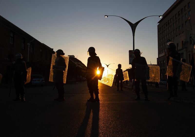 Anti-riot police block the entrance to the Magistrates court after the Zimbabwe main opposition party Movement of Democratic Changes (MDC) appeal against the banning or protests was dismissed by a magistrate  in Bulawayo, Zimbabwe. Getty Images