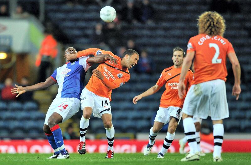 Blackburn Rovers Ayegbeni Yakubu (left) battles for the ball with Newcastle United's James Perch during the Carling Cup, Fourth Round match at Ewood Park, Blackburn.   (Photo by Martin Rickett/PA Images via Getty Images)